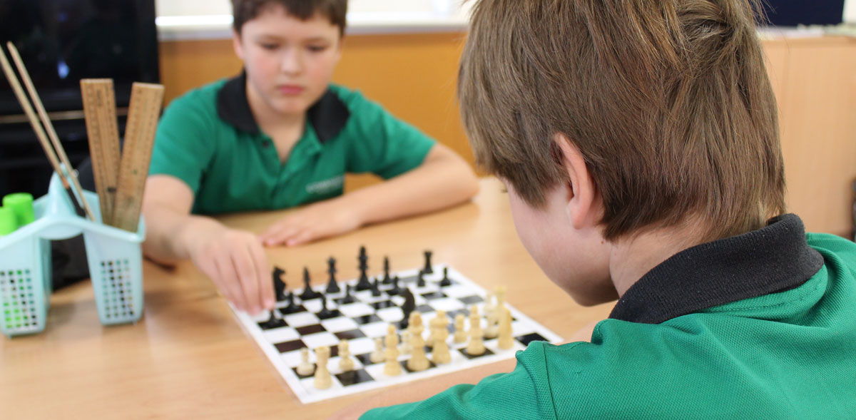 Students playing chess