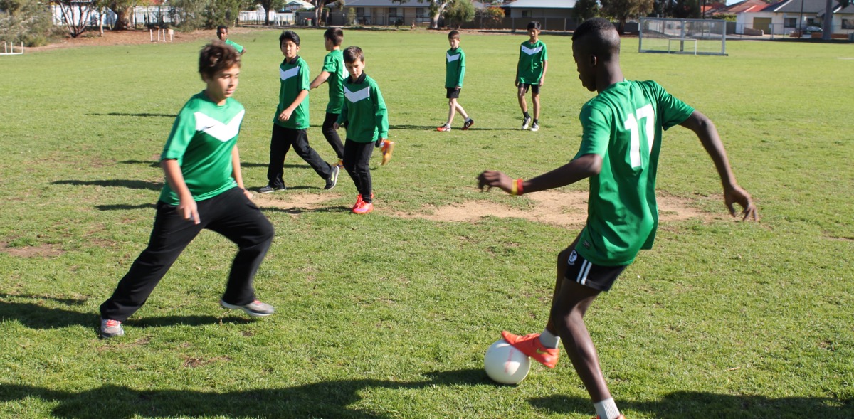 Students playing soccer