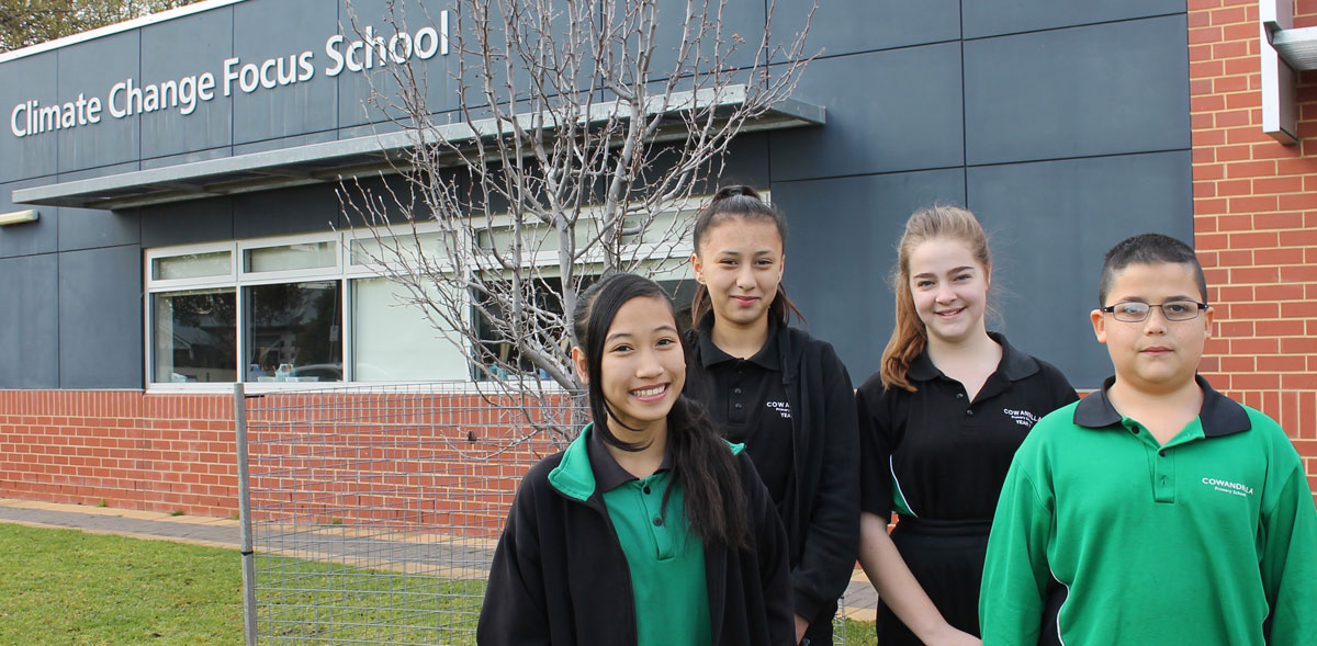 Students with Climate Change Focus School sign