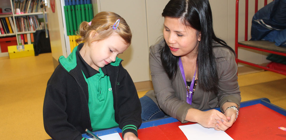 Student and teacher writing