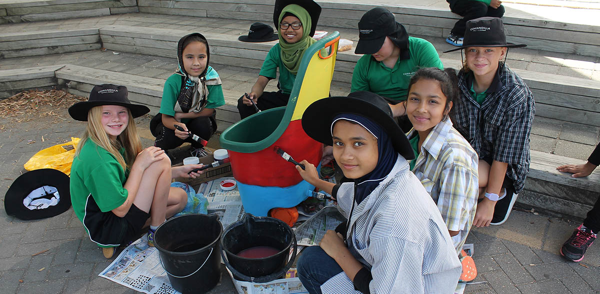 Students painting outside